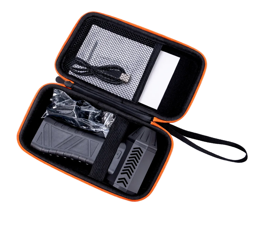 Black and orange carrying case with electronic devices on a white background