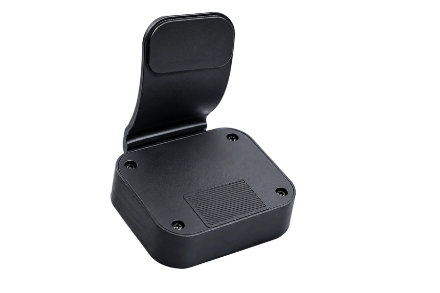 Black plastic component on a gray background