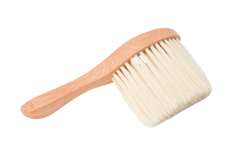 Wooden brush with bristles on a white background