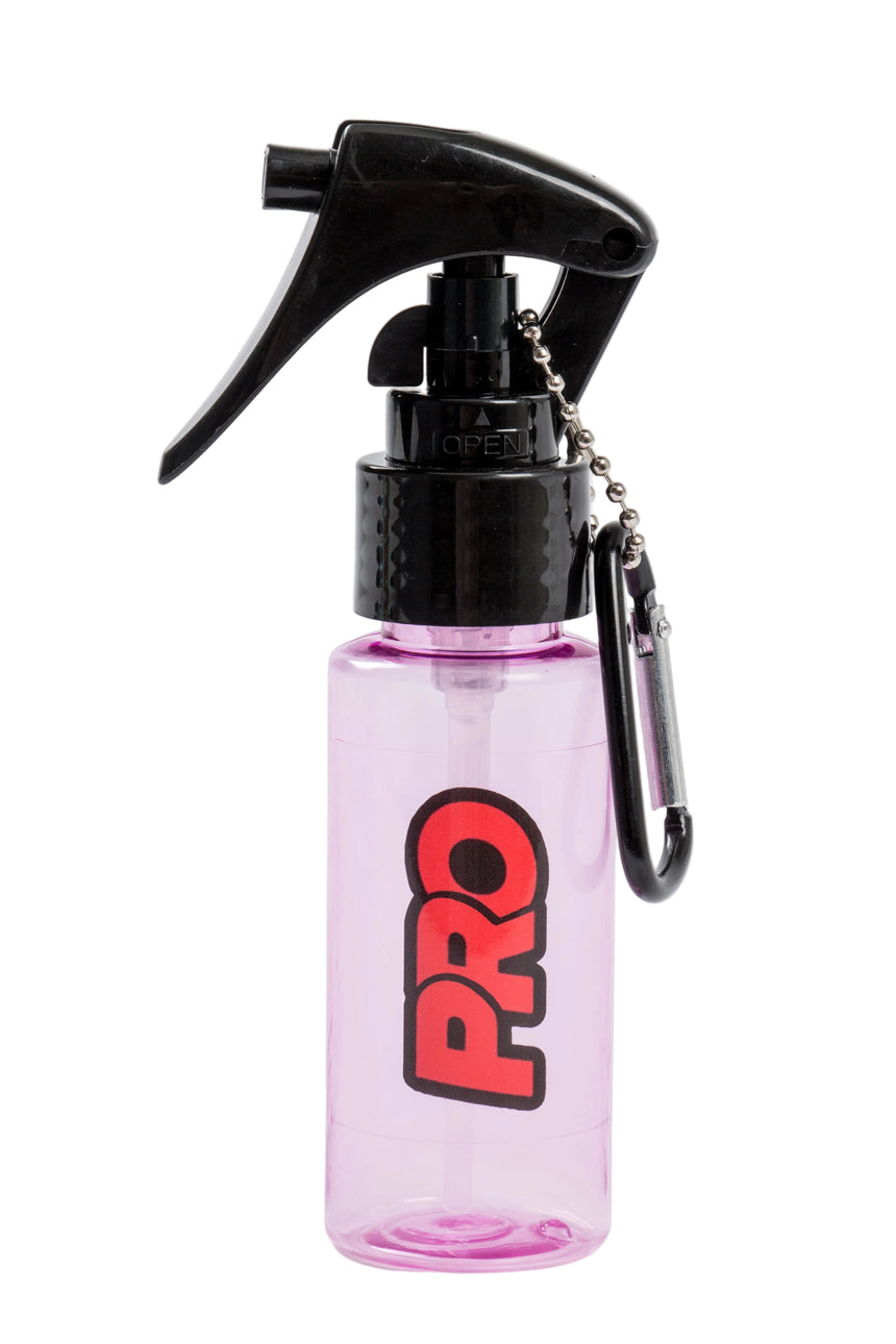 Pink spray bottle with black nozzle and carabiner on a white background