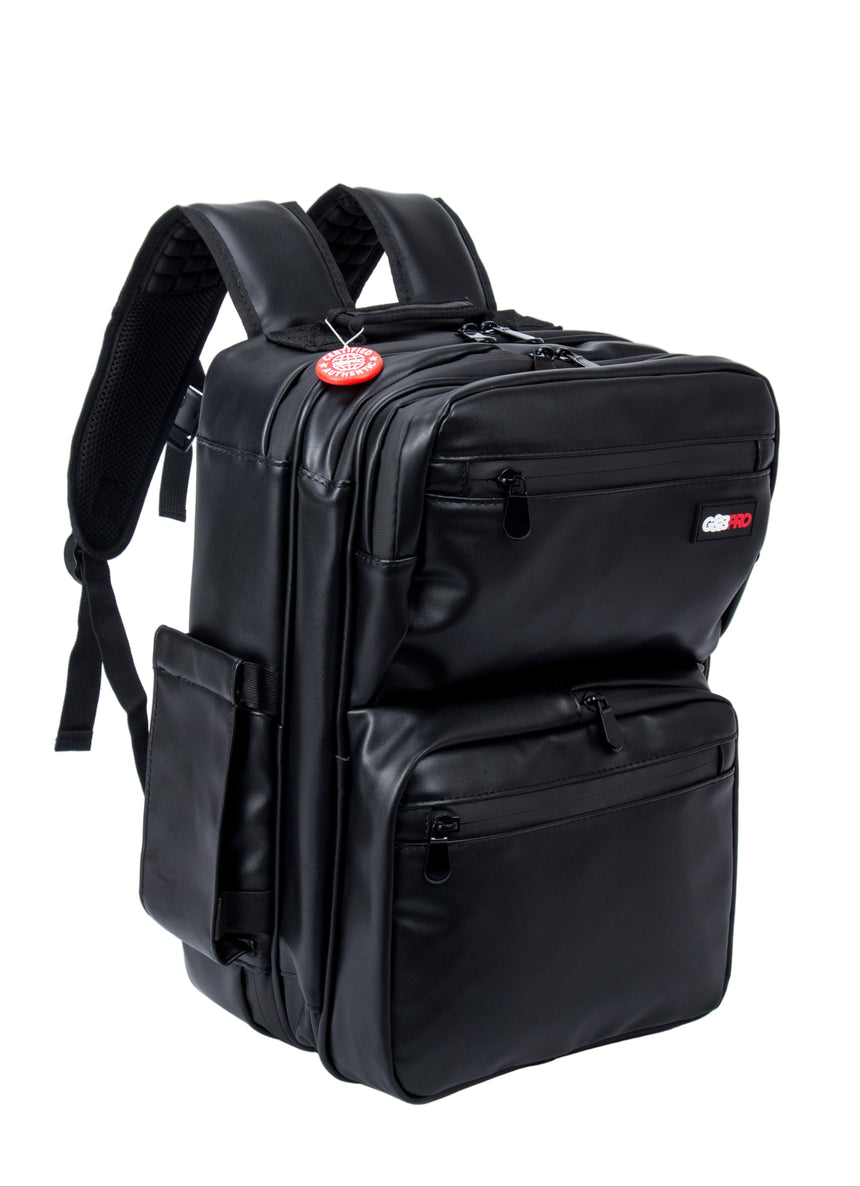 Black backpack with multiple pockets and a red tag on a white background
