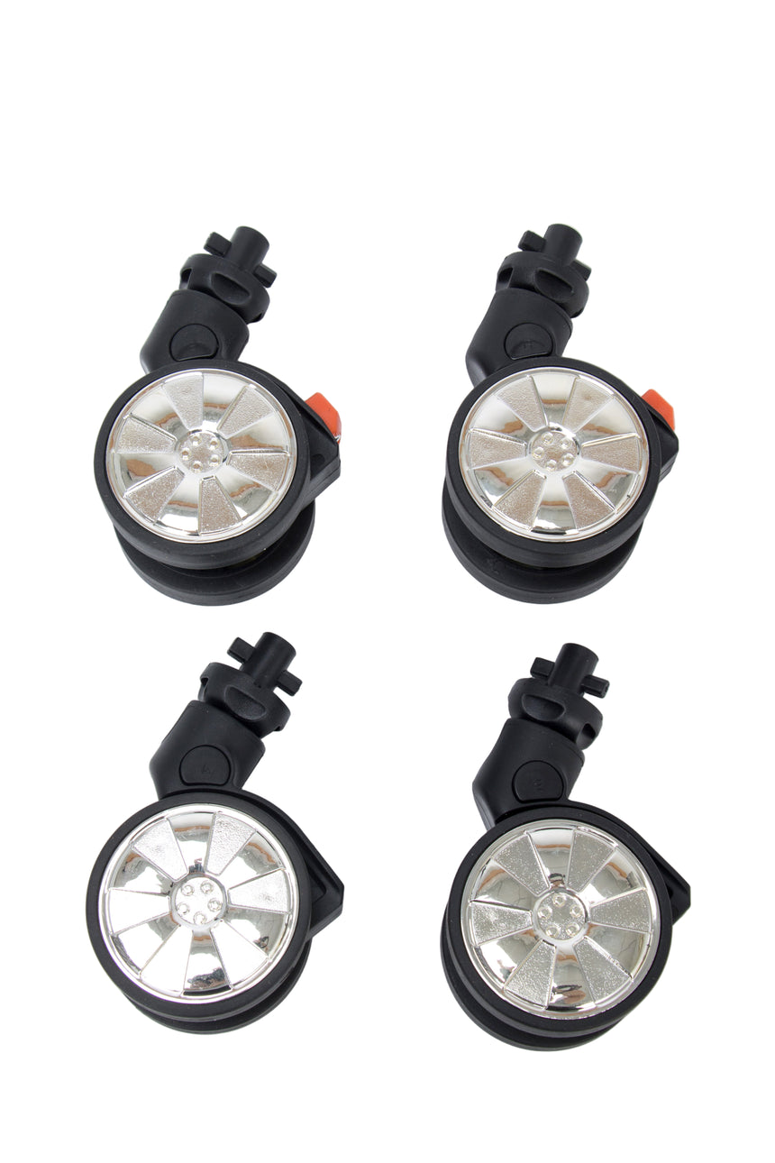 Four wheel-style lights on a white background