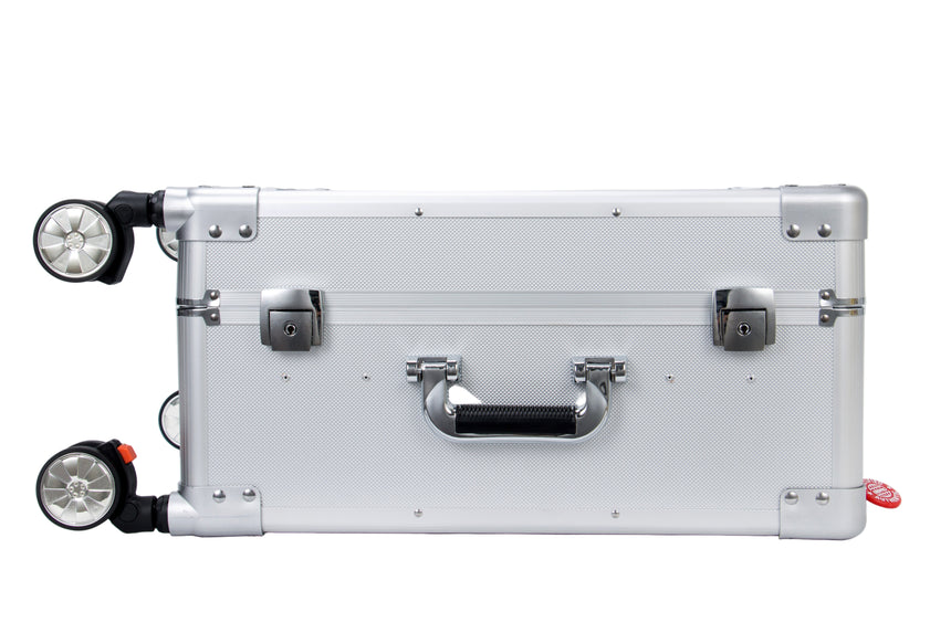 Silver suitcase with wheels on a white background