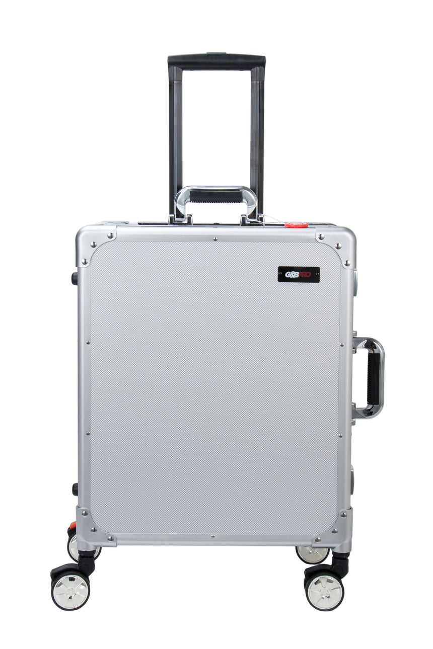 Silver suitcase with black handle and wheels on a white background
