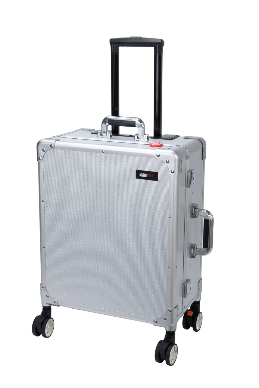 Silver suitcase with wheels and a handle on a white background