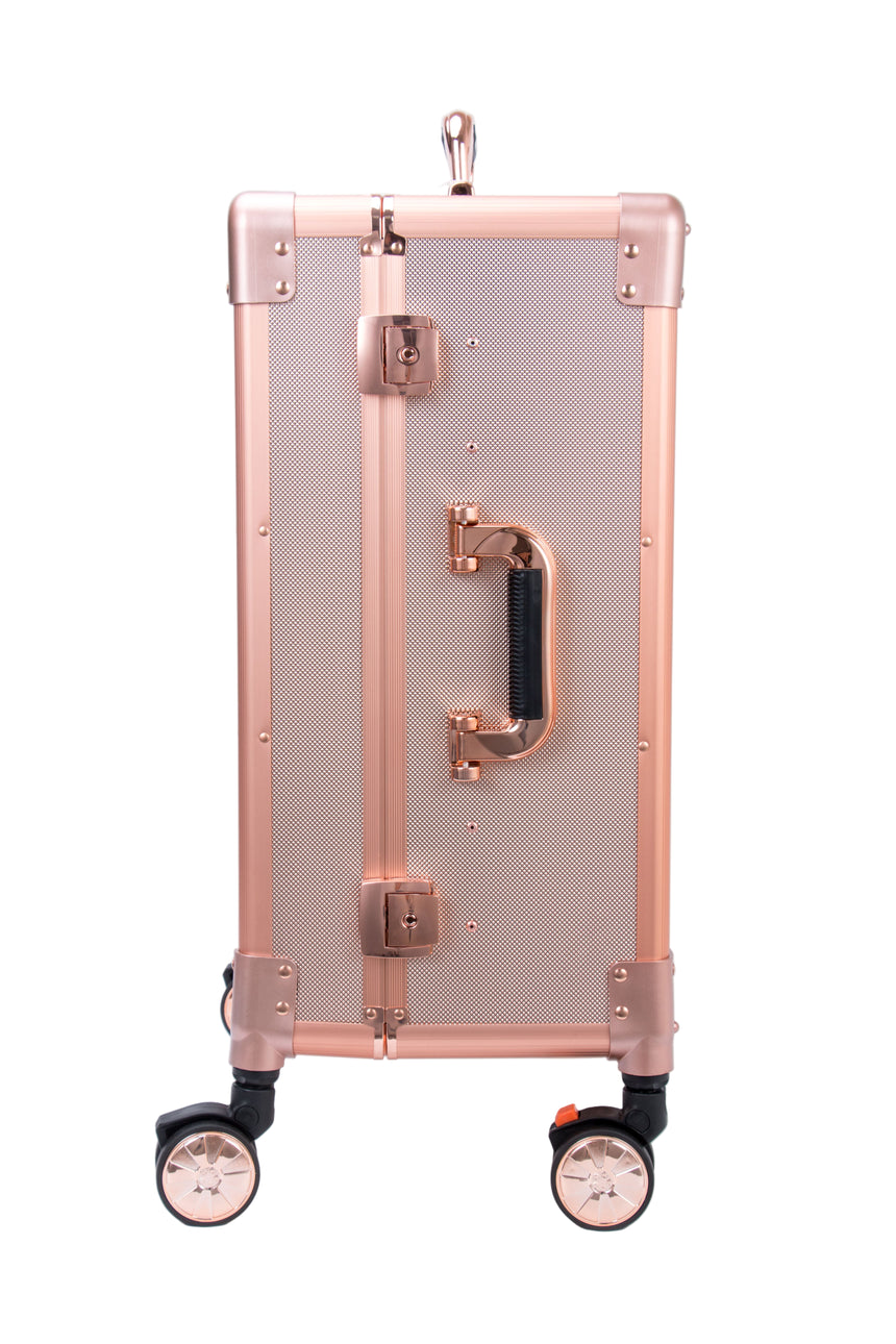 Rose gold suitcase with wheels on a white background