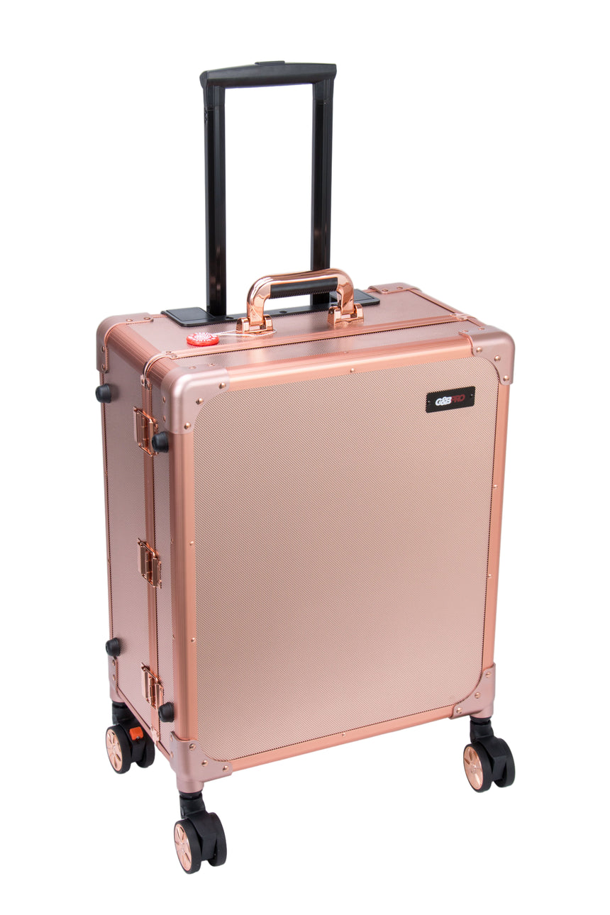 Rose gold suitcase with black handle and wheels on a white background