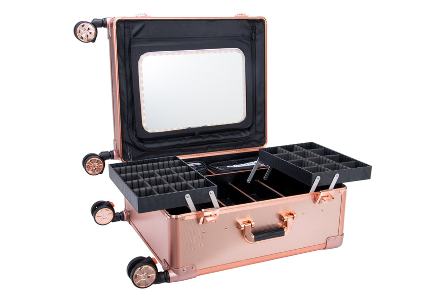Rose gold jewelry case with compartments on a white background