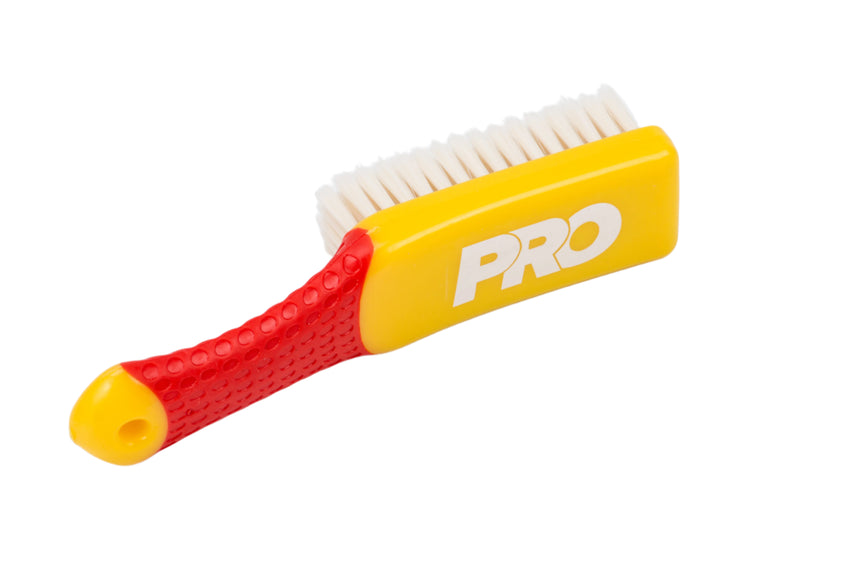 Hairbrush with red handle and yellow body labeled 'PRO' on a white background