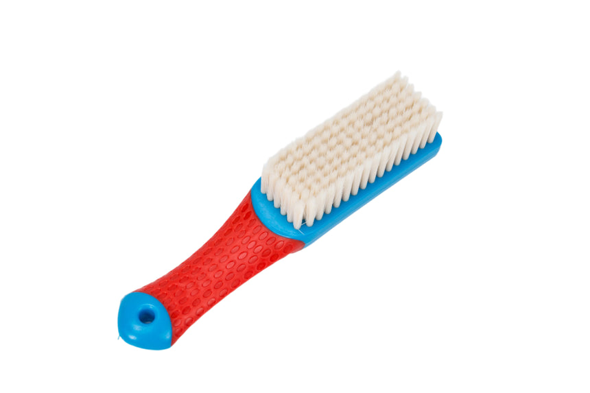 Cleaning brush with red handle and blue grip on a white background