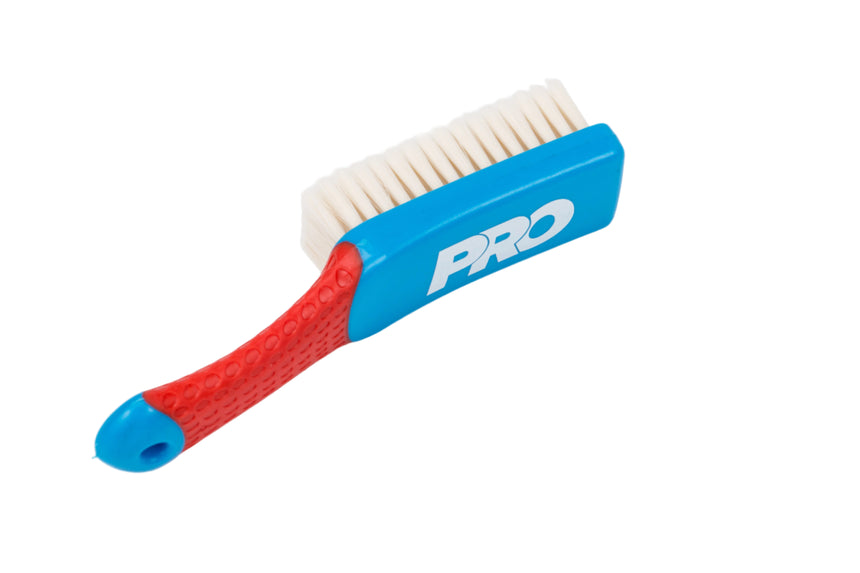 Brush with red handle and blue body labeled 'PRO' on a white background