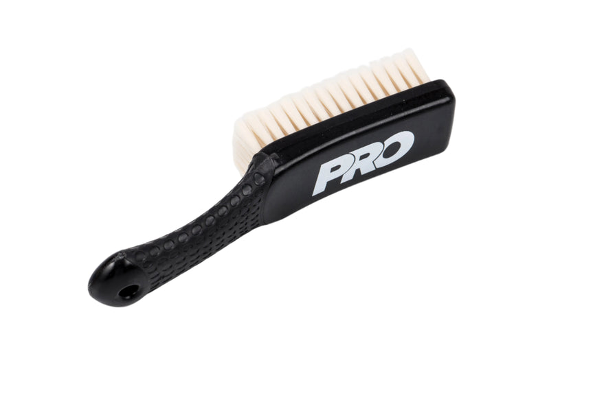 Black brush with white bristles on a white background