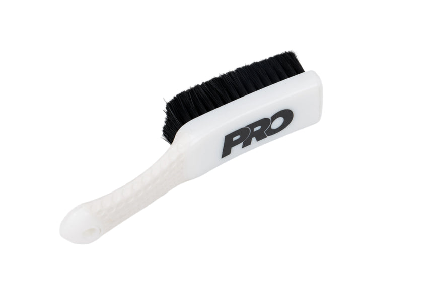 White brush with black bristles and 'PRO' branding on a white background