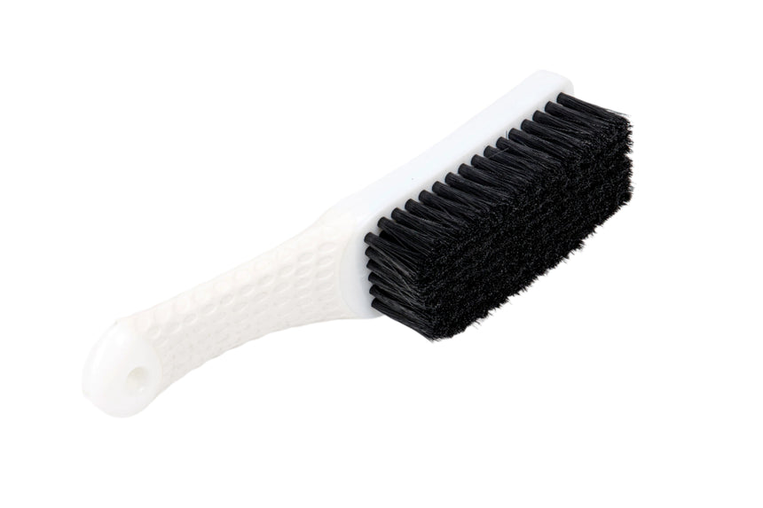 Black brush with white handle on a white background