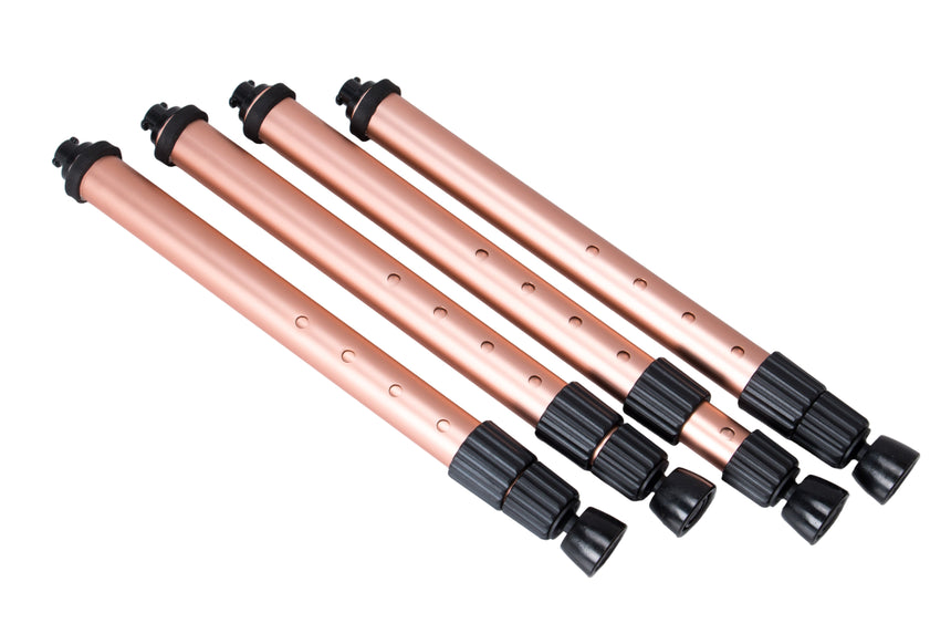 Set of copper-colored metal rods with black ends on a light gray background