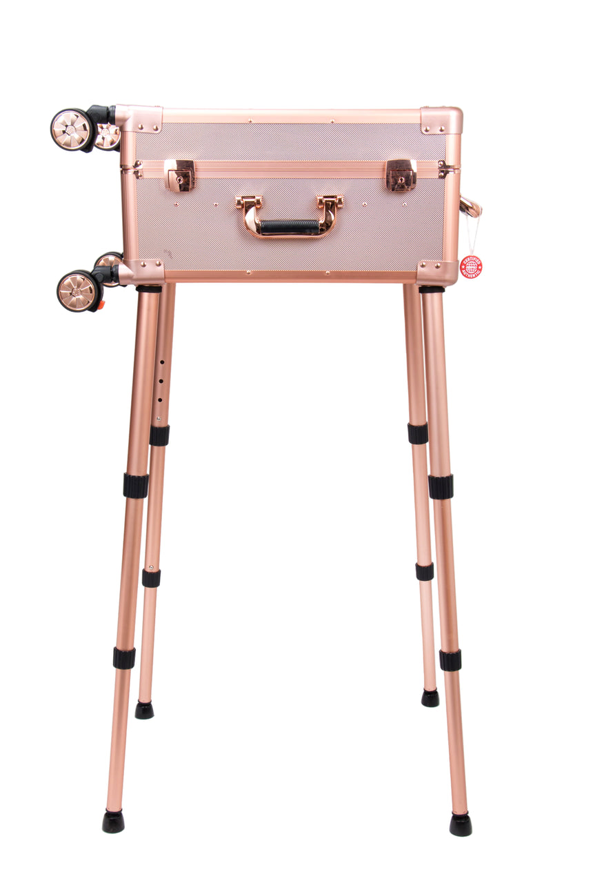 Rose gold suitcase on a stand against a white background