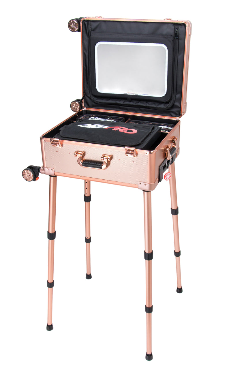 Rose gold vanity case with mirror and black interior on a white background