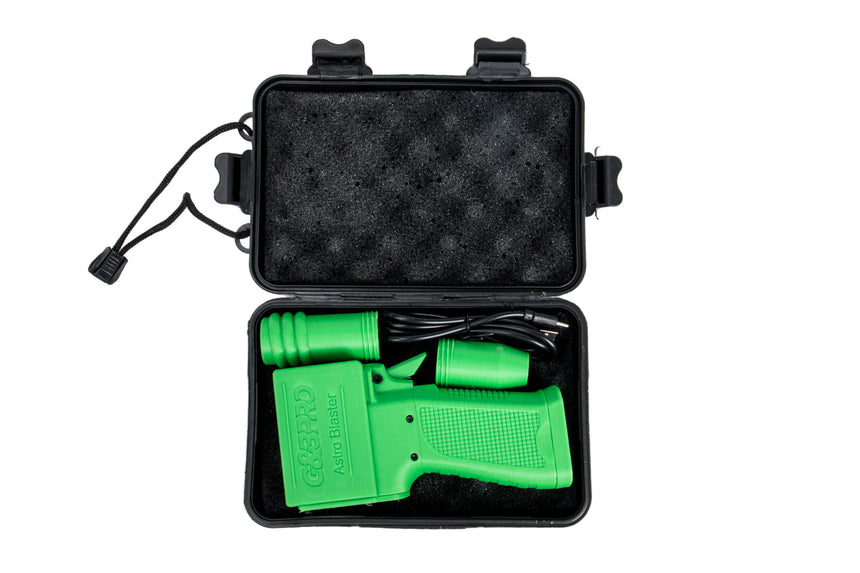 Green electronic device with cable in a black carrying case on a white background