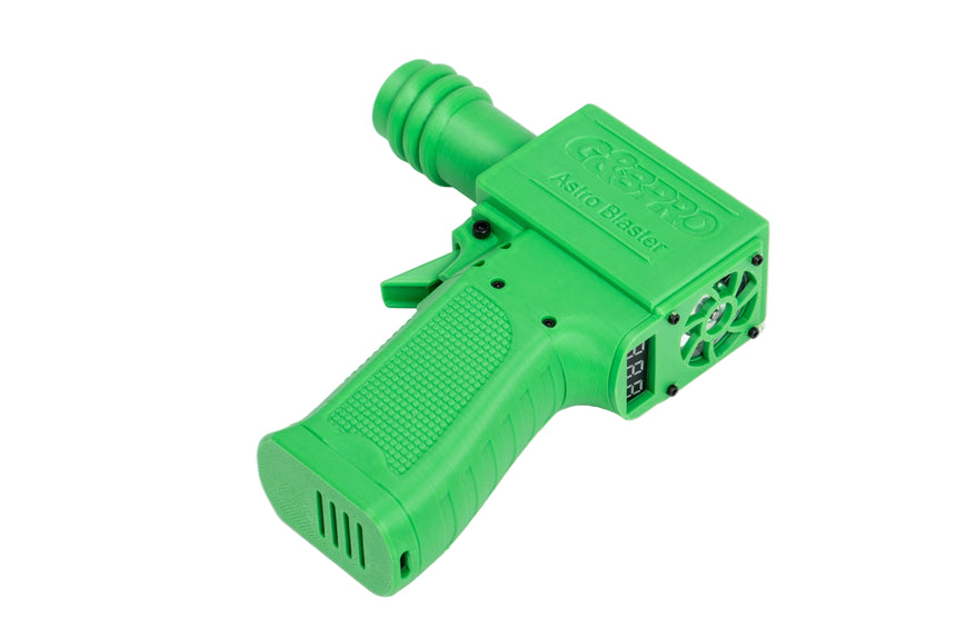 Green plastic gun-shaped device on a white background