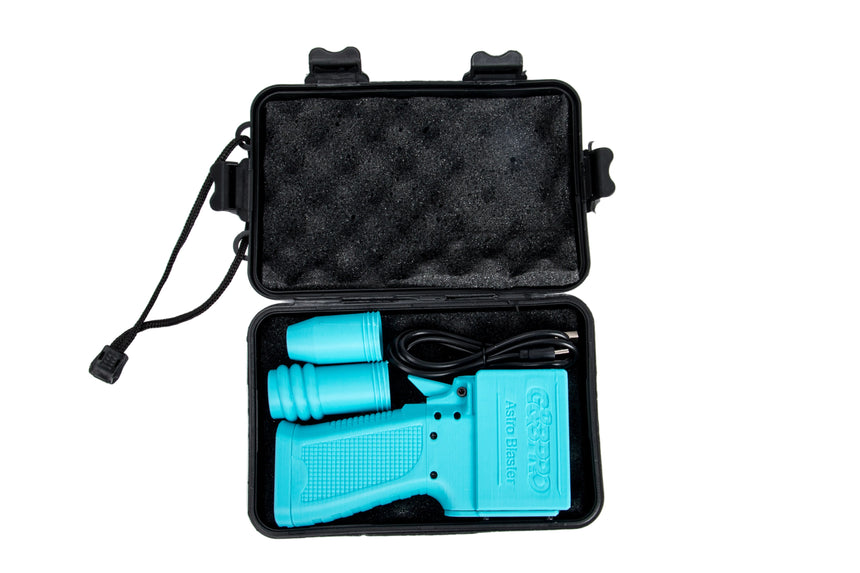 Turquoise tool with black cable in an open black case on a white background