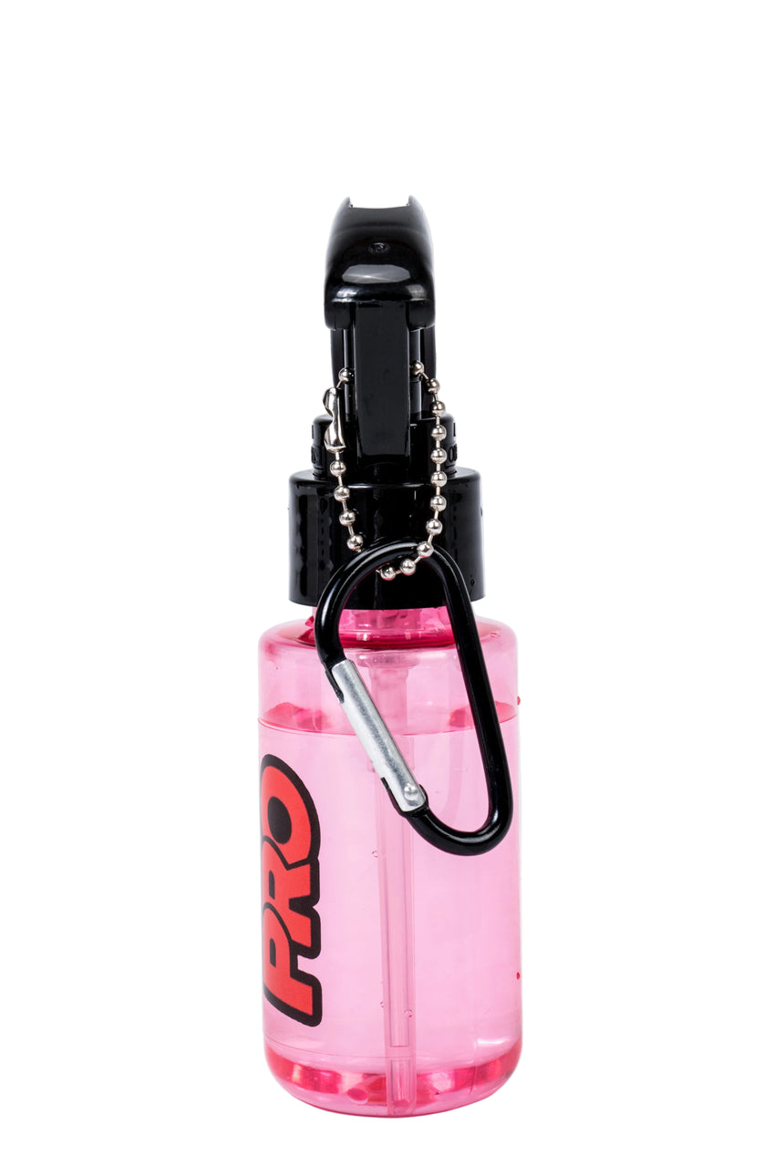 Pink water bottle with black carabiner and clip on a white background