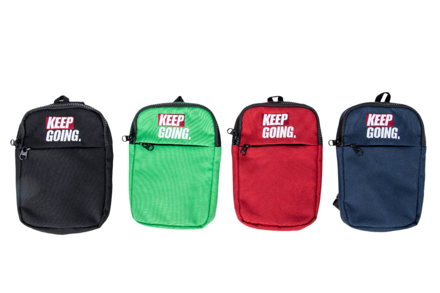 Four small bags in black, green, red, and blue with 'KEEP GOING.' text on a white background