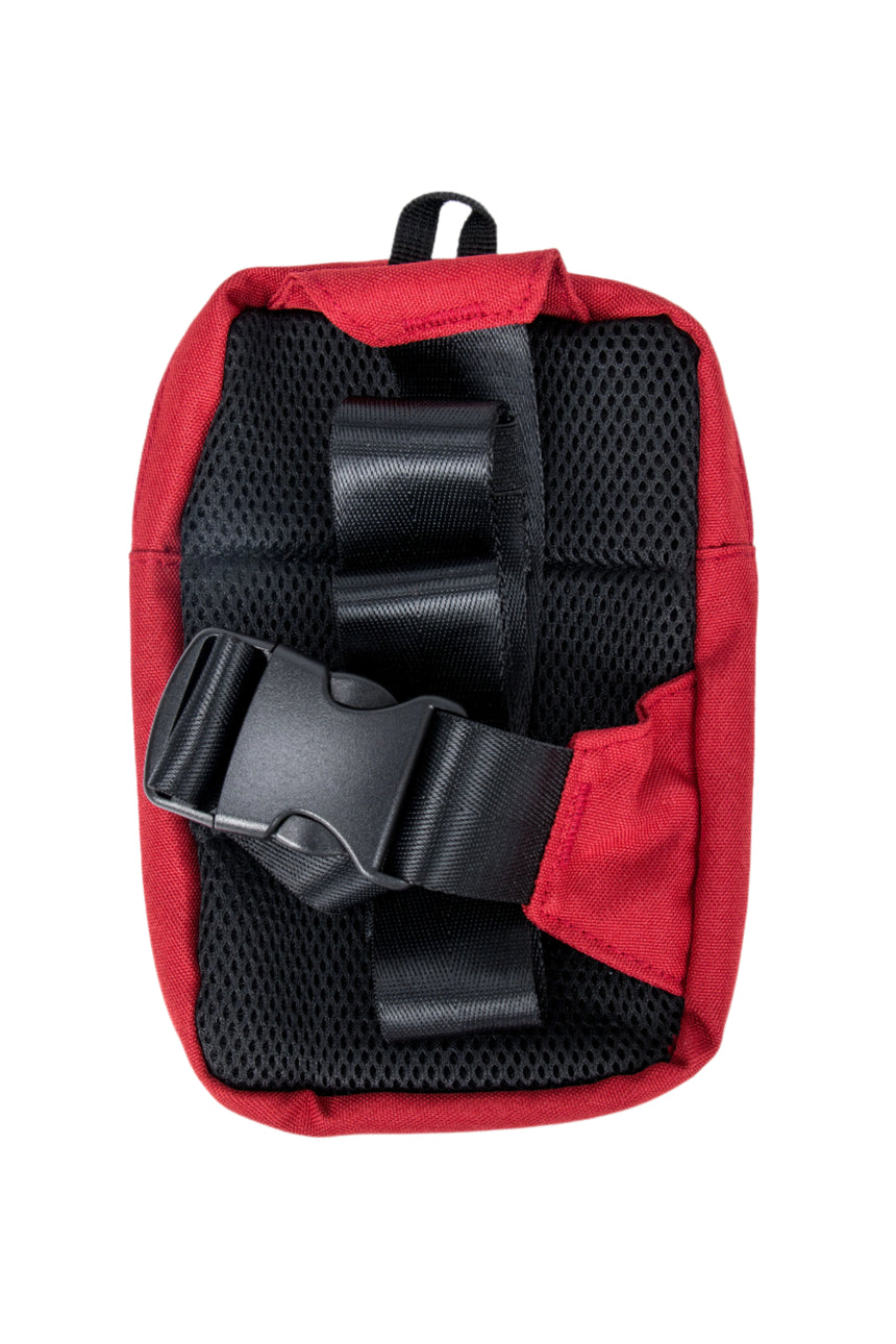 Red bag with black interior and straps on a white background