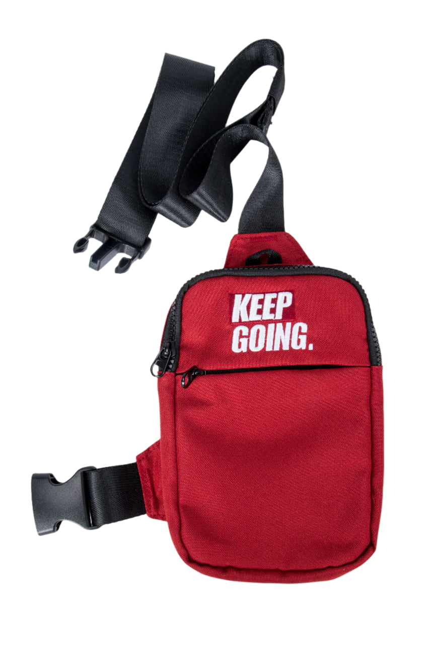 Red waist bag with 'KEEP GOING.' text on a white background