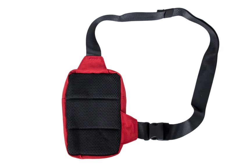 Red waist bag with a black strap on a white background