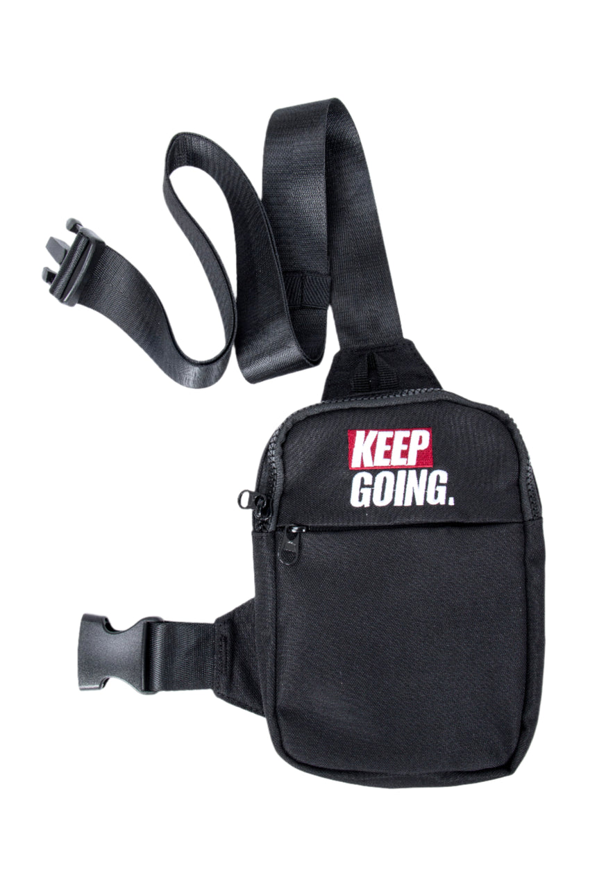 Black waist bag with 'KEEP GOING.' text on a white background