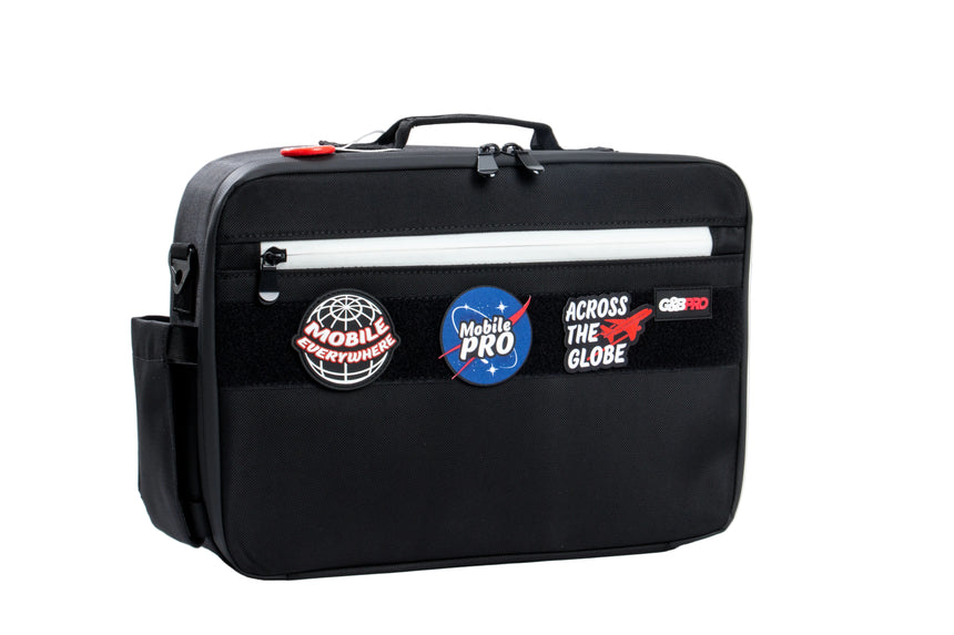 Black bag with various stickers on a white background
