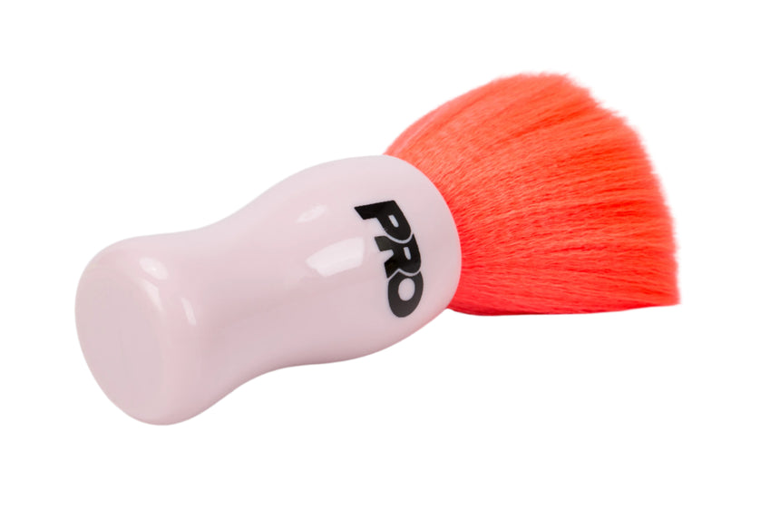Pink cleaning brush with orange bristles on a white background