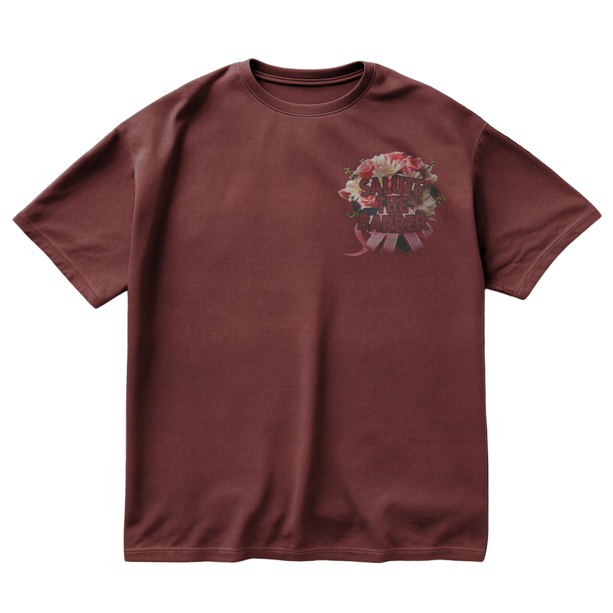 Maroon t-shirt with floral graphic and text on a black background
