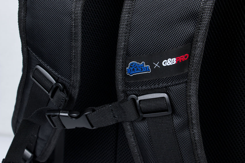 Black backpack with visible branding on a black background