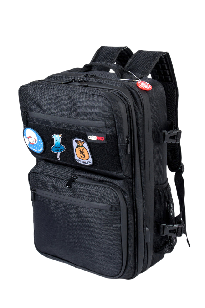 Black backpack with colorful patches on a white background