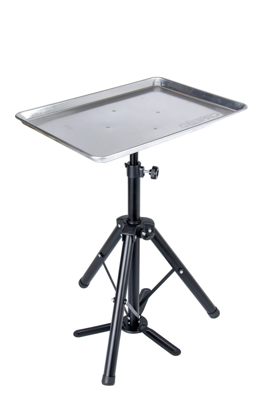 Tripod stand with a metal tray on a white background