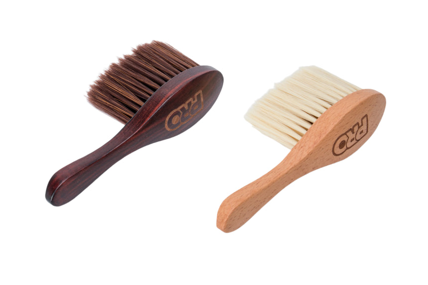 Two brushes with wooden handles and bristle heads on a white background, branded 'PRO'.