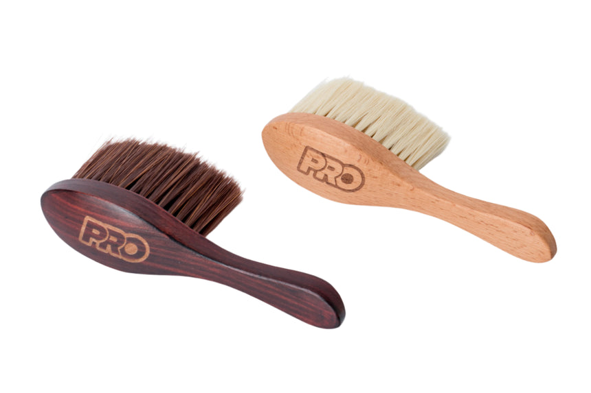 Two wooden brushes with bristle heads on a white background, branded 'PRO'.
