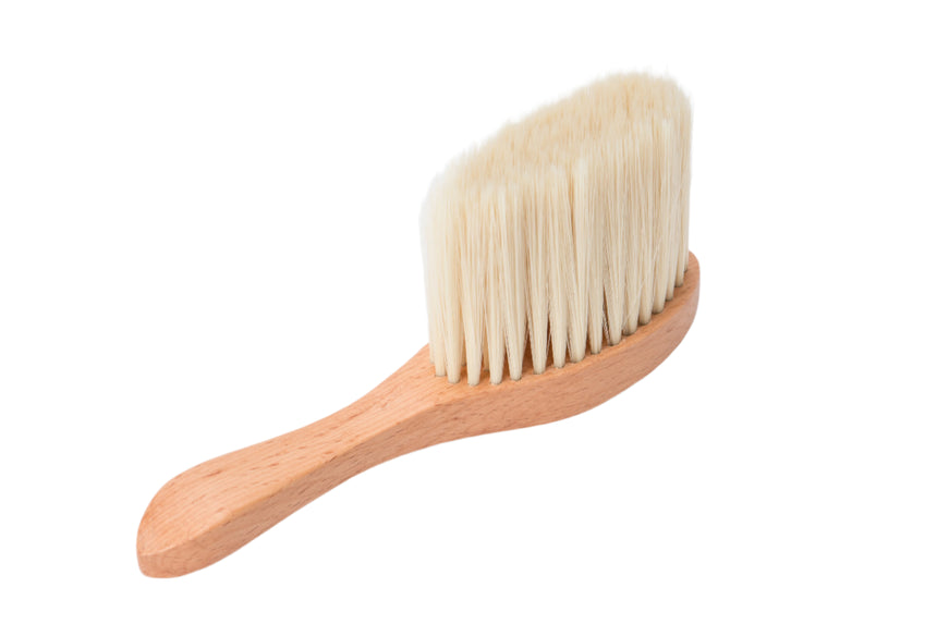 Wooden brush with bristle head on a white background