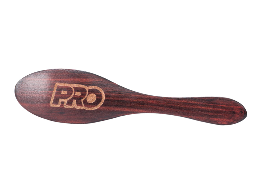 Wooden spoon with 'PRO' branding on a white background