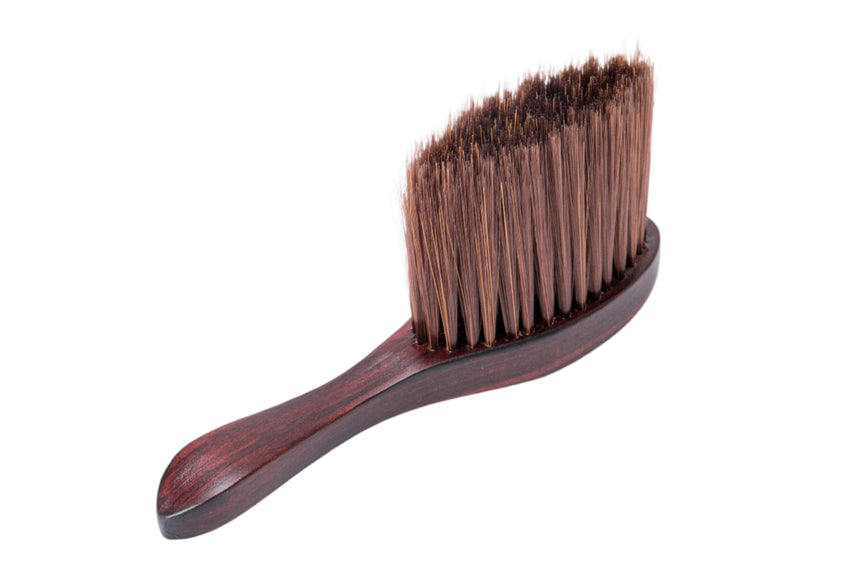 Wooden brush with bristles on a white background