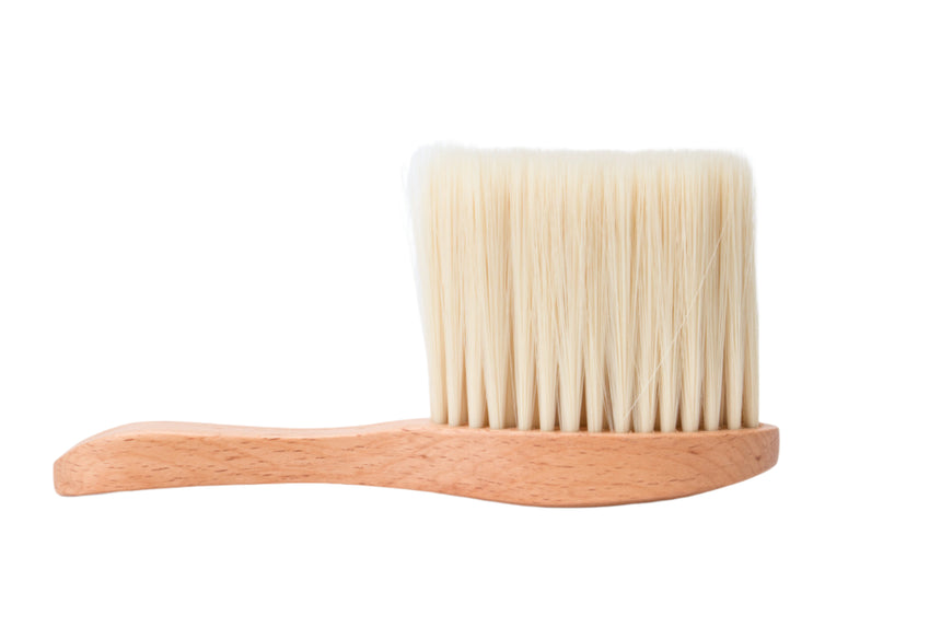 Wooden brush with bristles on a white background