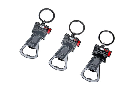 Three bottle opener keychains on a white background