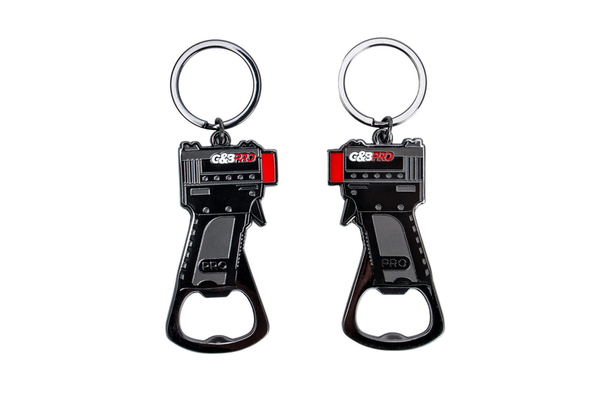 Two black and red keychain bottle openers on a white background