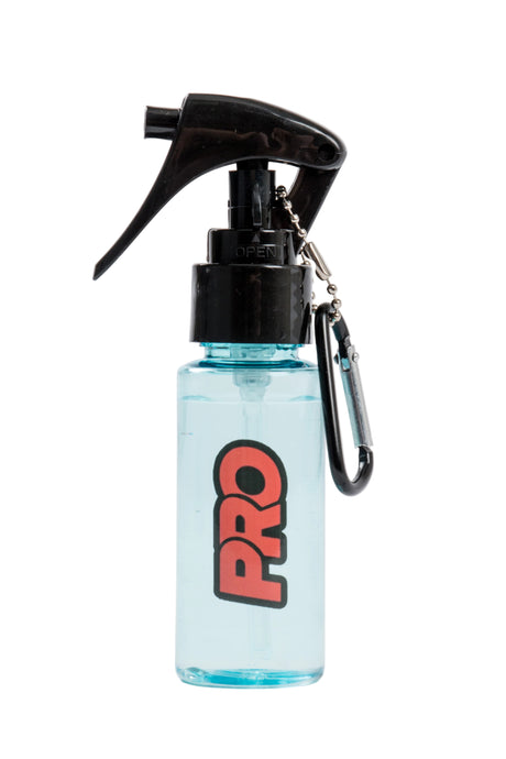 Small spray bottle with black nozzle and 'PRO' logo on a light gray background
