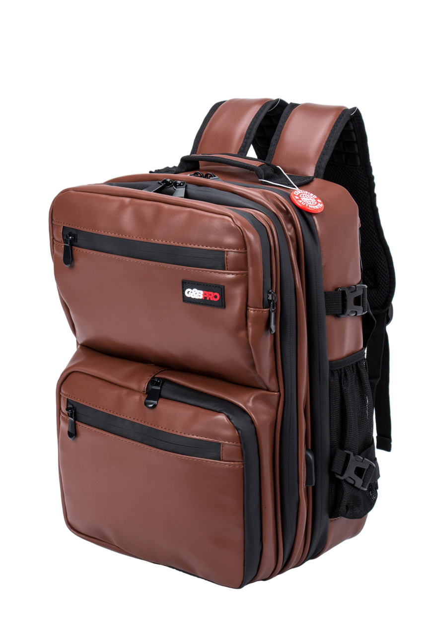 Brown backpack with black zippers on a white background