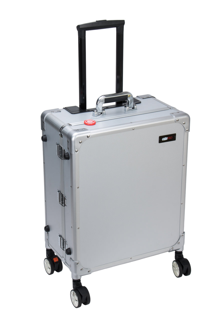 Silver rolling suitcase with black handle on a white background