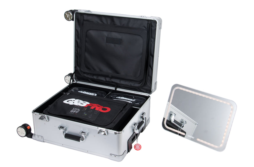 Open silver briefcase with black interior on a white background