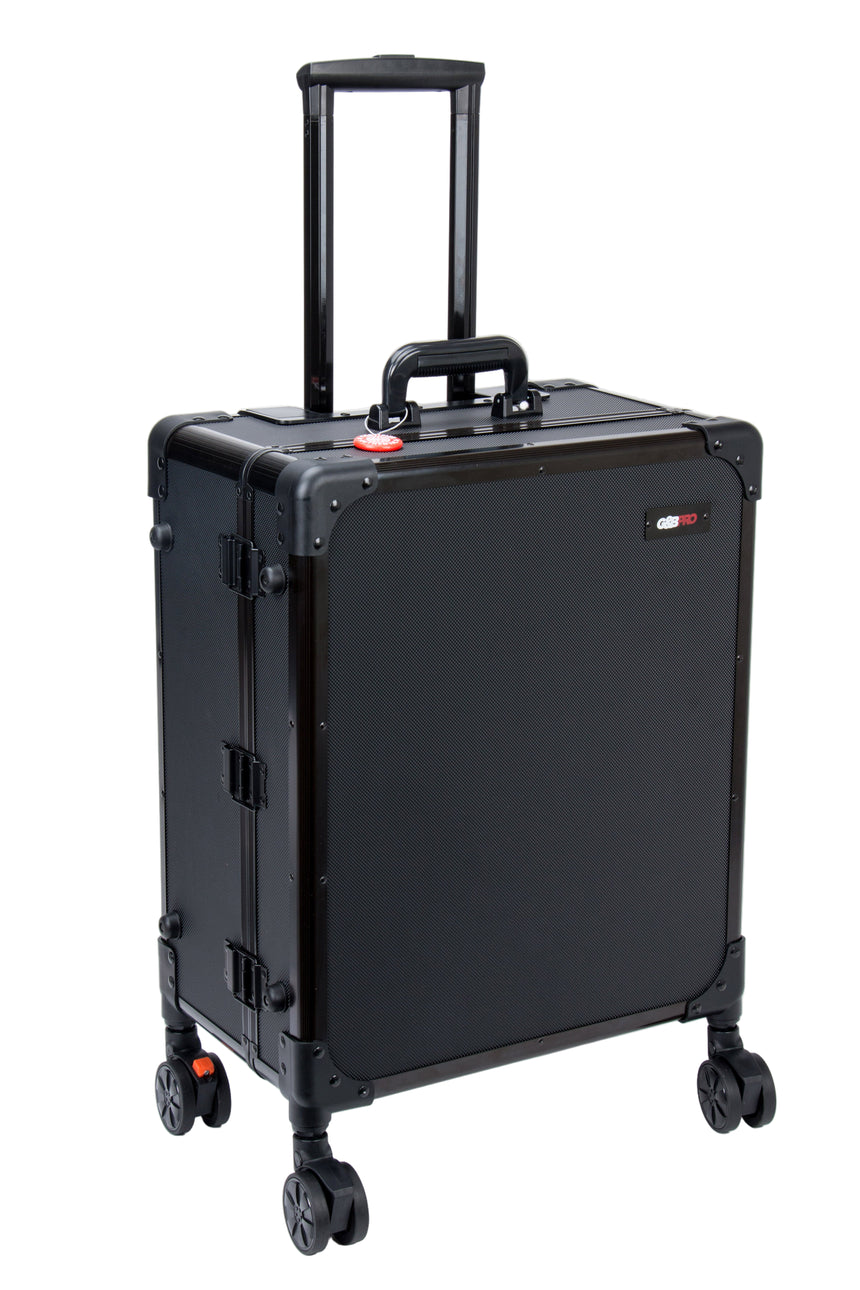 Black suitcase with wheels and handle on a white background