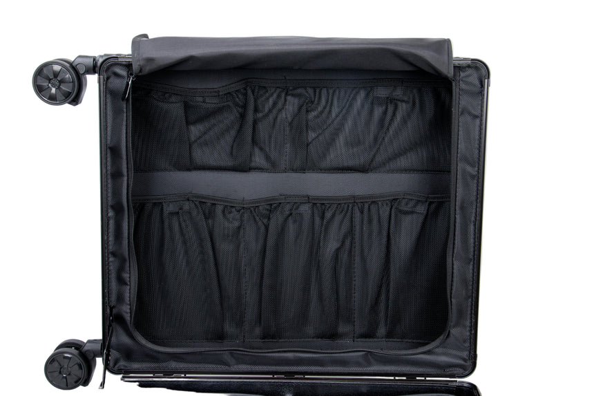 Black suitcase with interior compartments on a white background